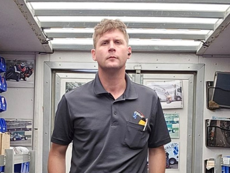 Chris Happel, NE DFW route representative, inside his stocked Cavalier route truck
