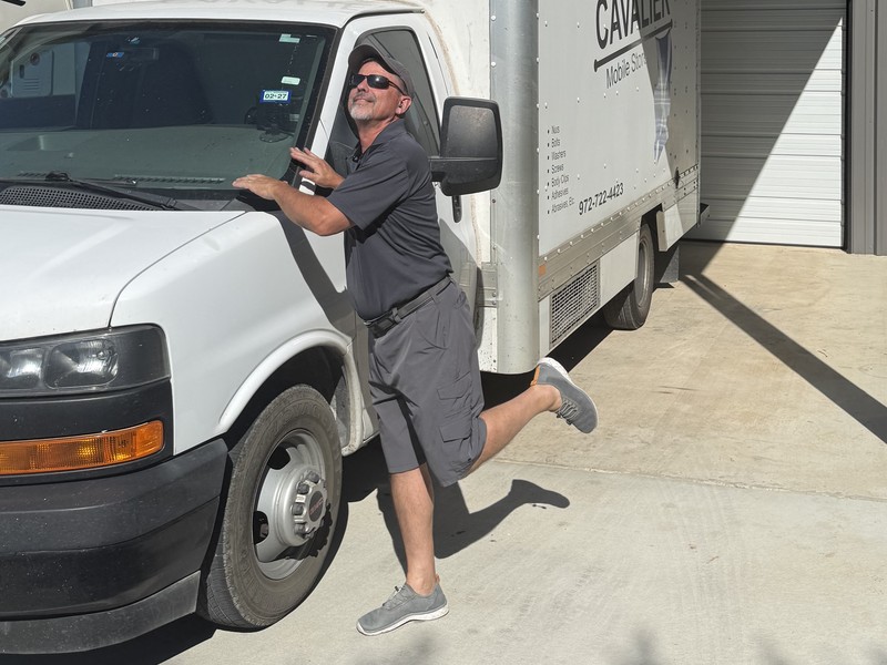 Chuck Jackson, West DFW route representative, with his Cavalier route truck