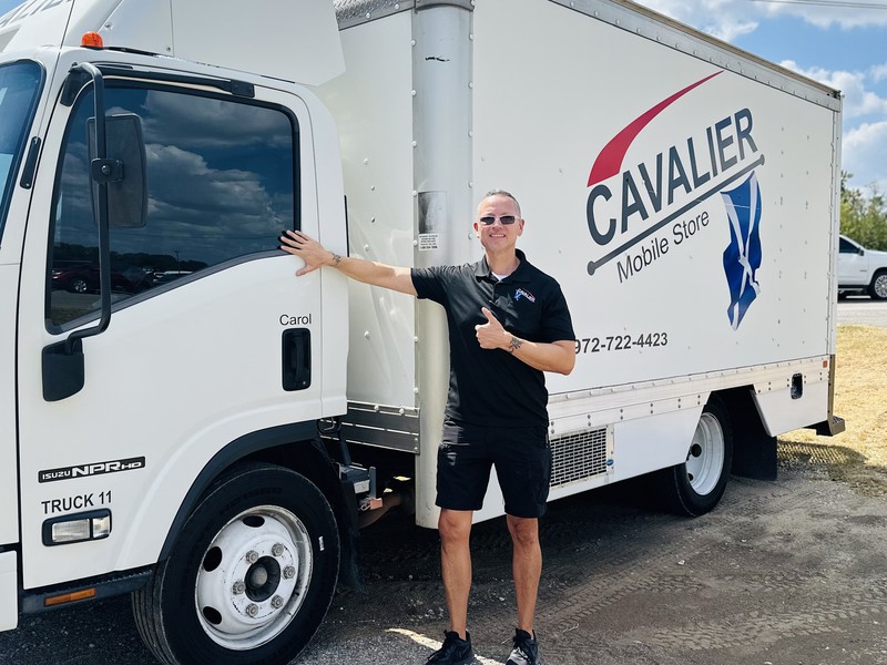 Lee Perales, San Antonio route representative, with his Cavalier Mobile Store route truck